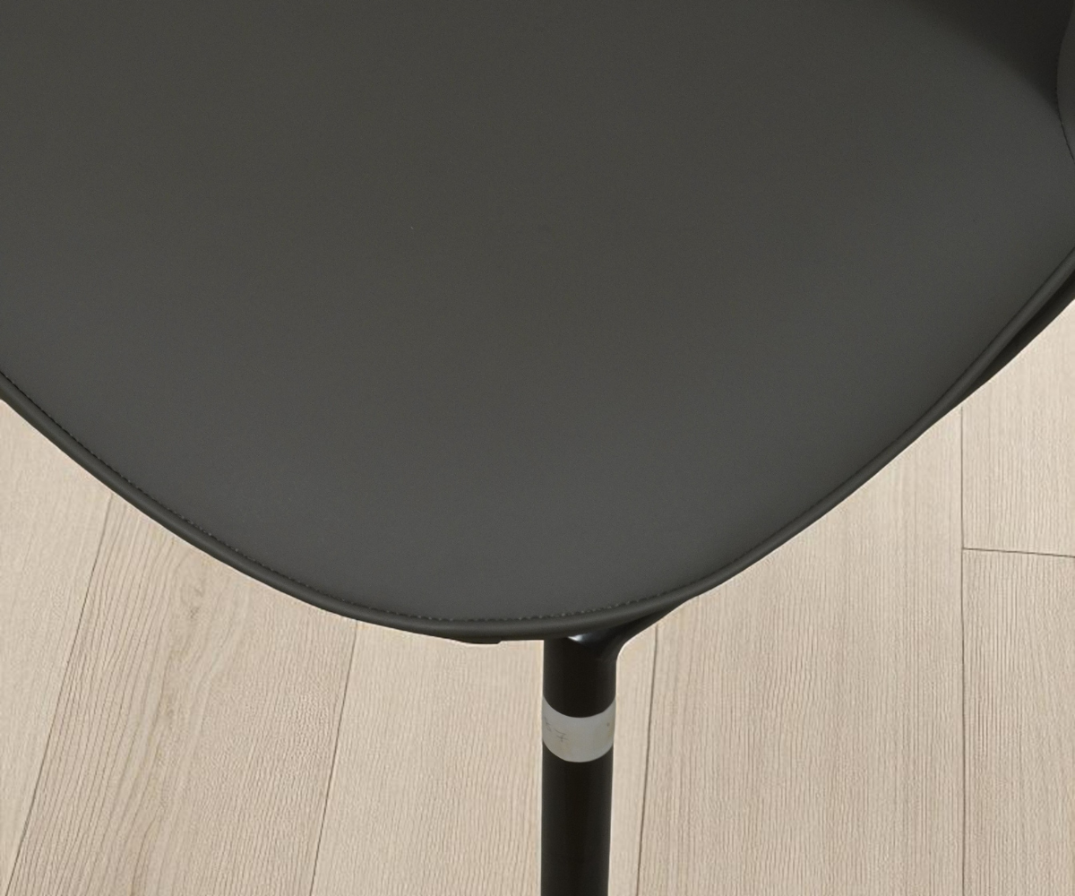 Dining chair 087 ash, angled view against a sage wall