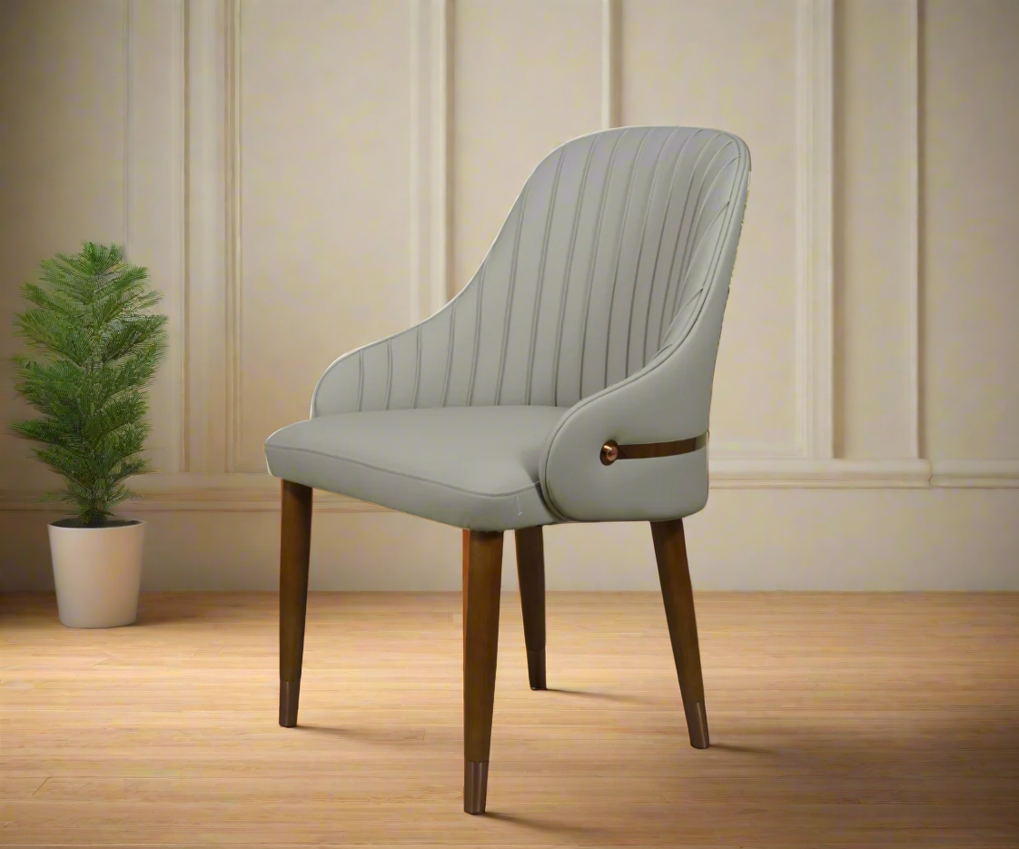 Dining chair B77, angled view beside a potted plant on a wood floor