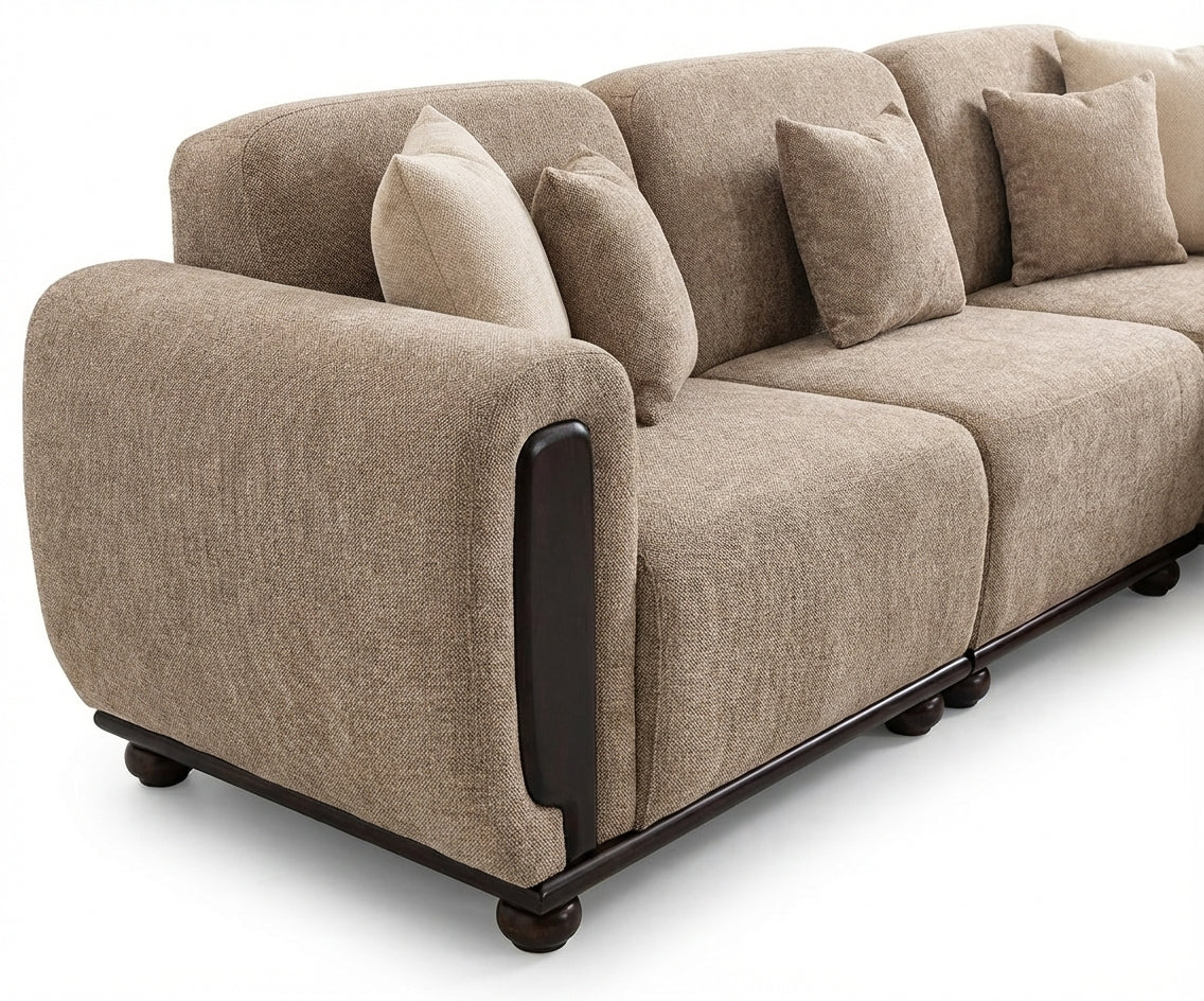 DREW beige fabric sofa with ottoman in a bright panelled living room