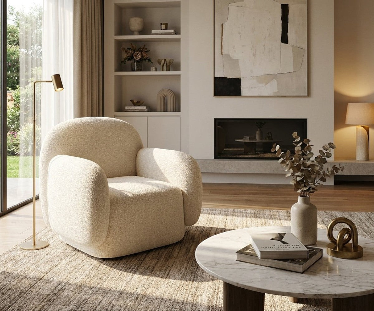 E06 cozy lounge armchair beside a fireplace in a warm living room