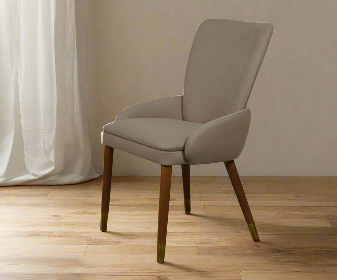 Eleganza taupe velvet 111, angled view beside a linen curtain
