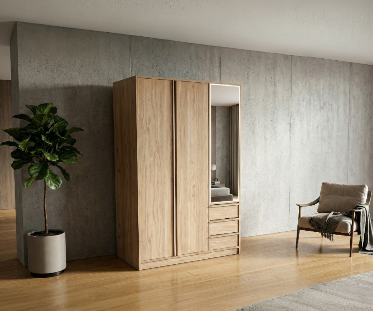ELIAS mirrored oak wardrobe in a concrete-walled bedroom beside an armchair