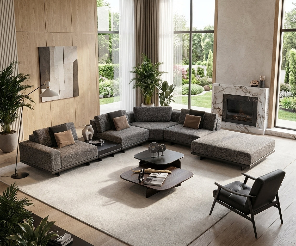 EXENCE grey corner sofa with ottoman in a bright garden-view living room