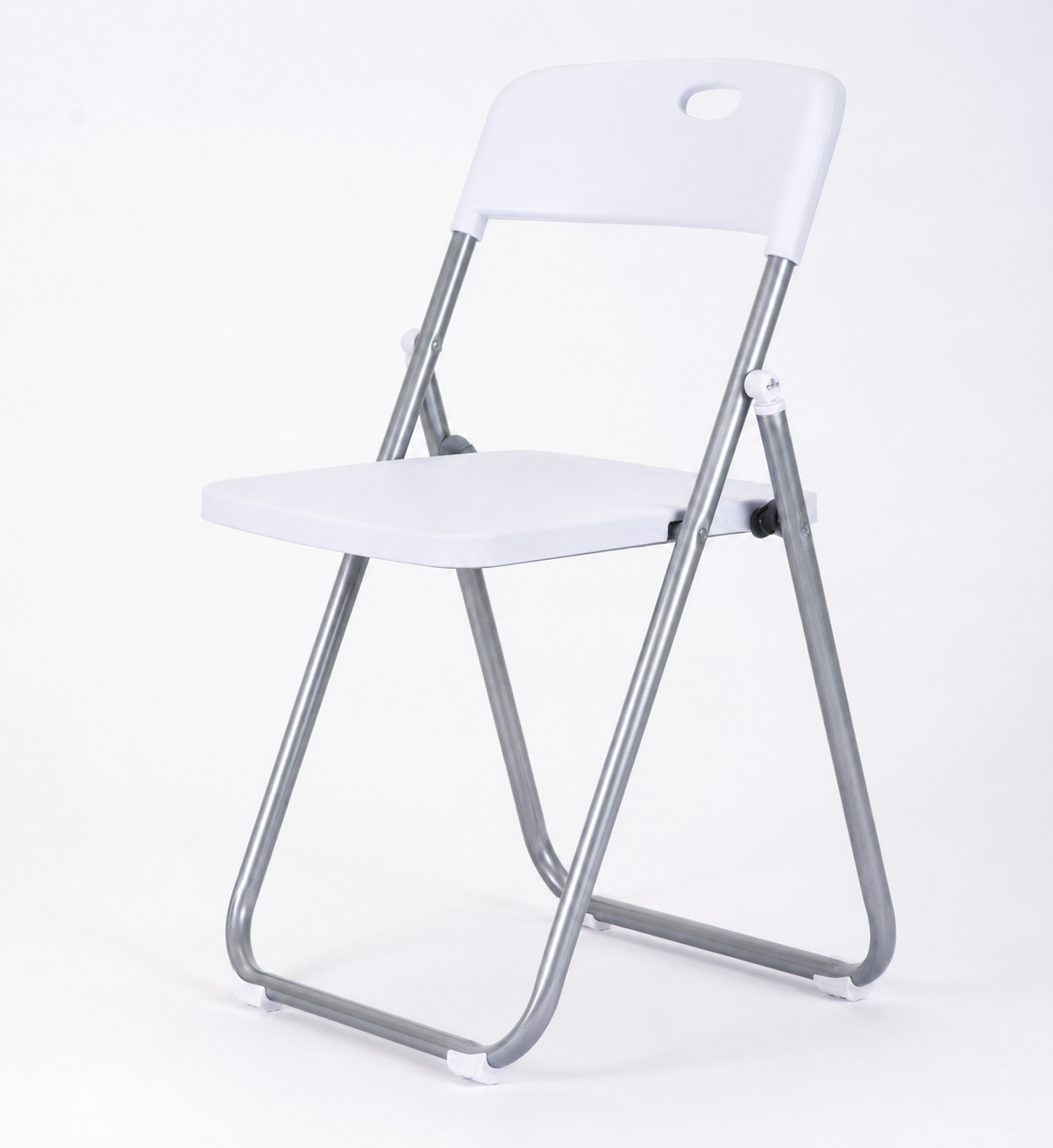 FANAR white folding chair 3017, folding set on a paved garden patio