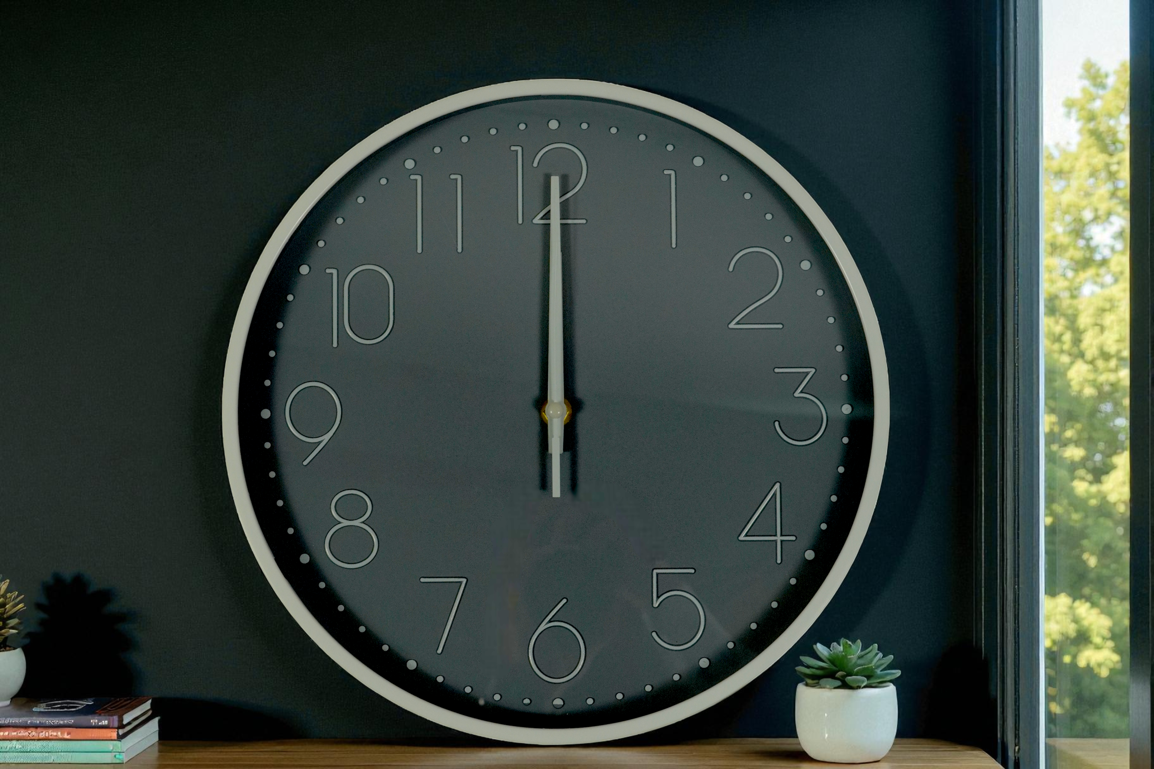 Forest green outline numeral wall clock on a dark wall beside a window