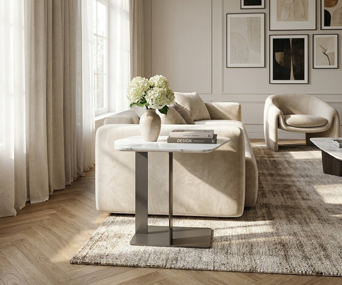 G63# silver glass table beside a sofa in a bright living room