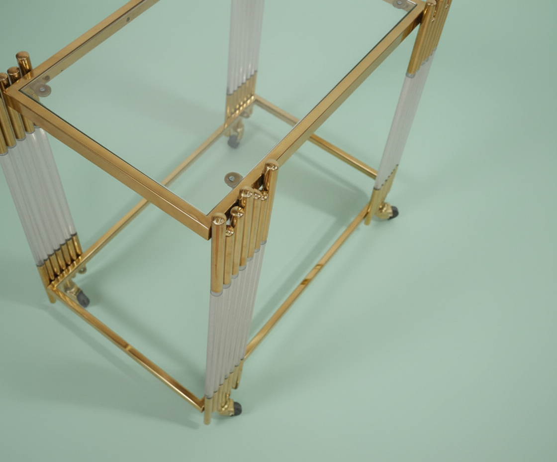 GLASS TROLLEY DC1016, angled view with glass shelves and fluted acrylic legs