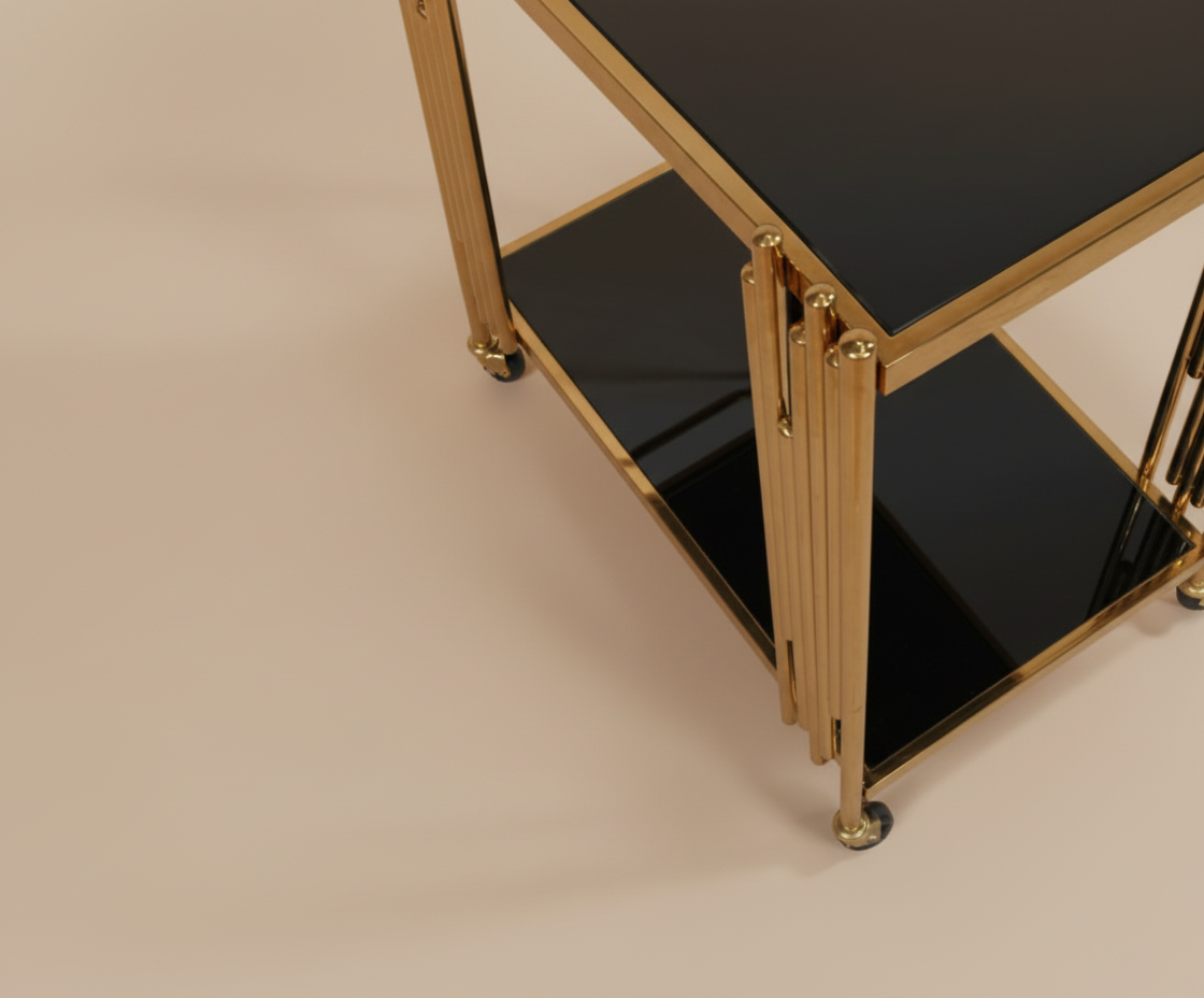 GLASS TROLLEY DC1039, angled view with black glass shelves and fluted brass legs