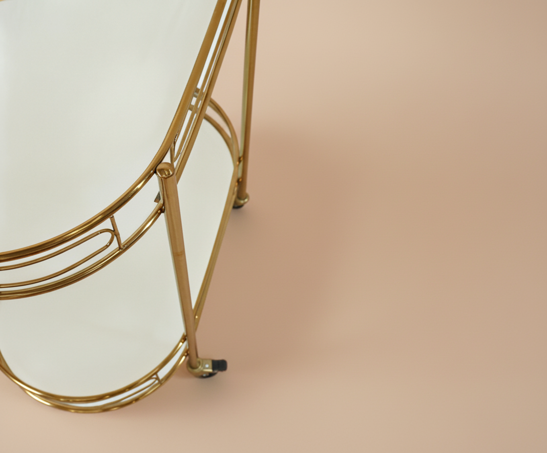 GLASS TROLLEY DC1080, front view of a two-tier oval brass cart