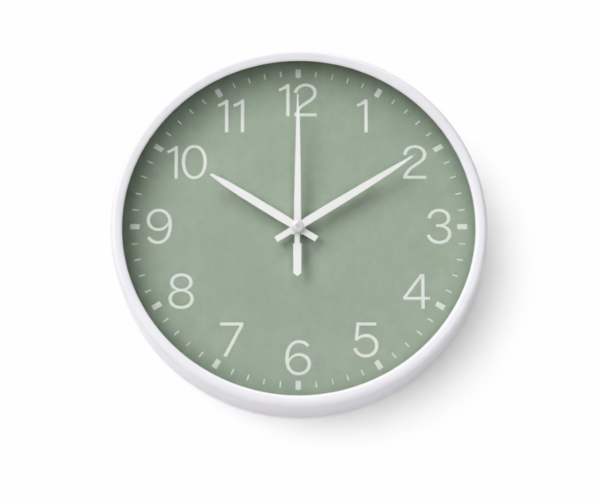 Green minimalist wall clock with a white rim and slim white hands