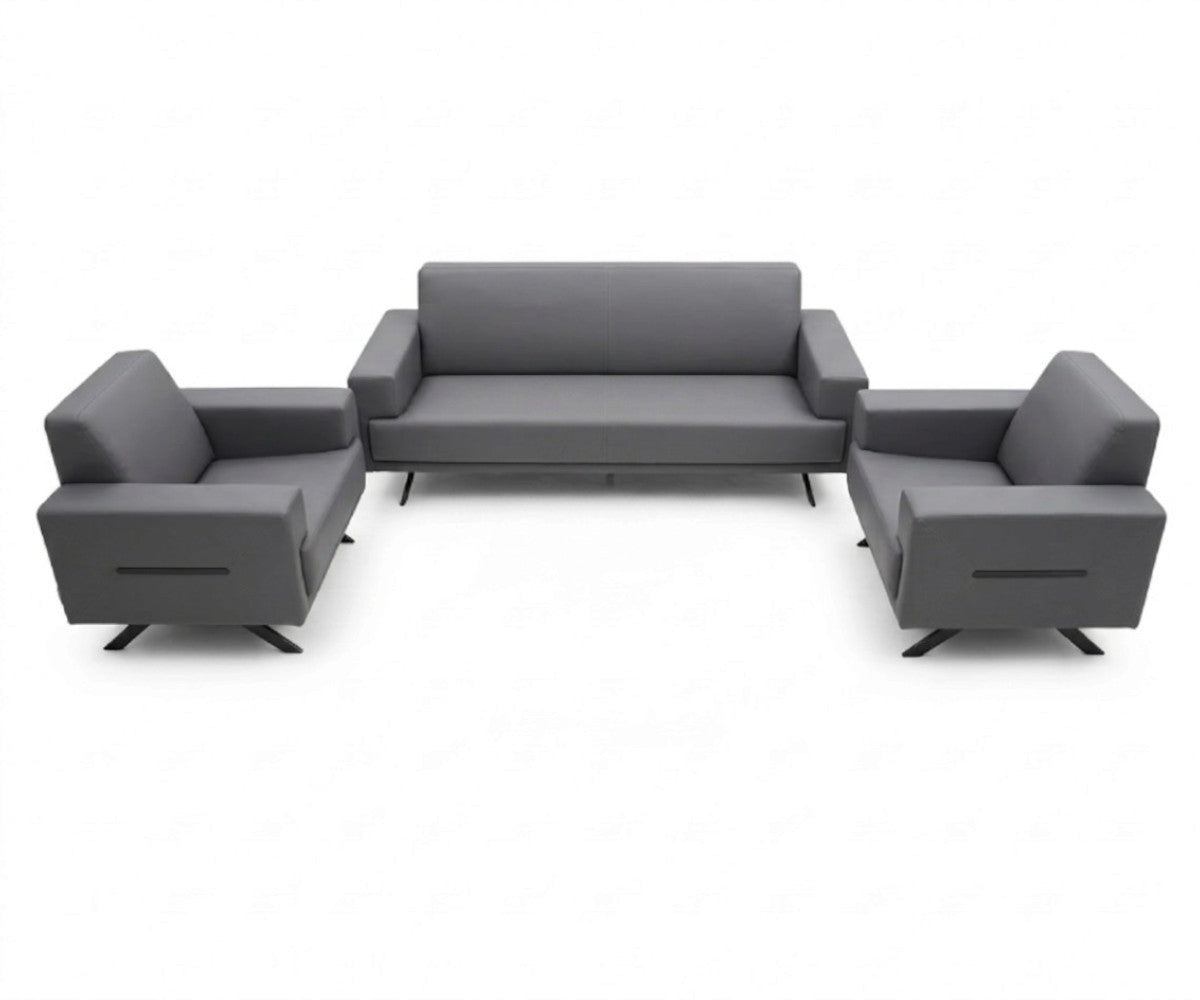 Grey three-piece sofa set with two matching armchairs in a luxurious, well-lit modern living room