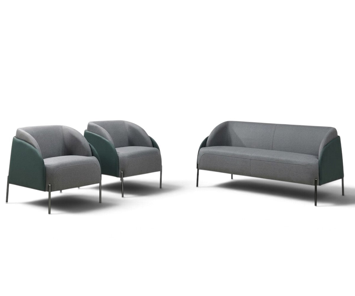 Grey and green three-piece sofa set with two matching armchairs in a luxurious, well-lit modern living room