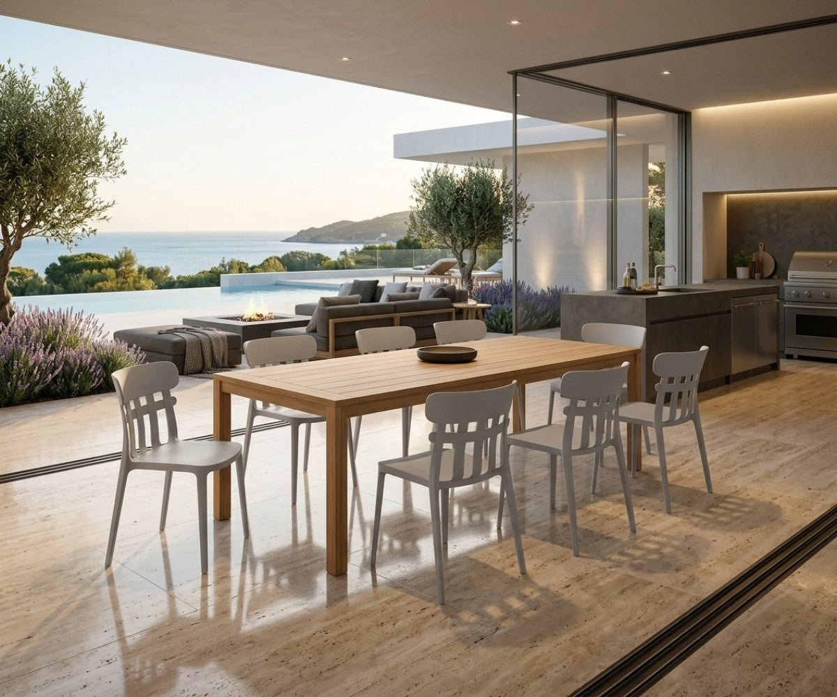 Light grey slat-back dining chair with curved top rail styled in a modern luxury dining room