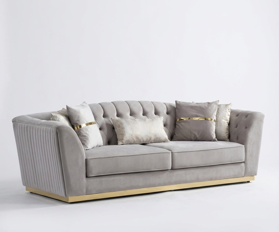 GUCCI grey velvet sofa set in a bright panelled living room