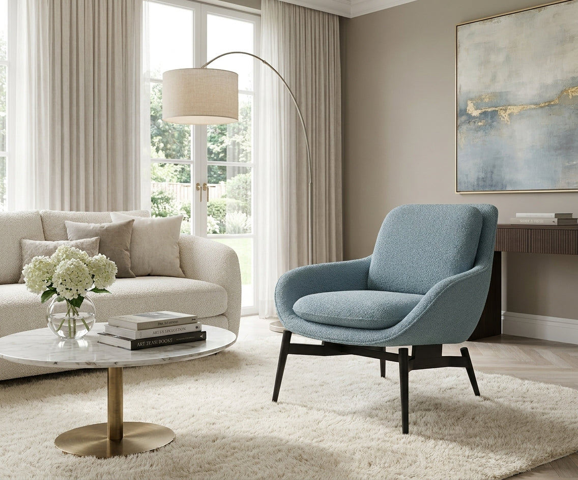 JYM1985 contemporary blue armchair beside a sofa in a bright living room