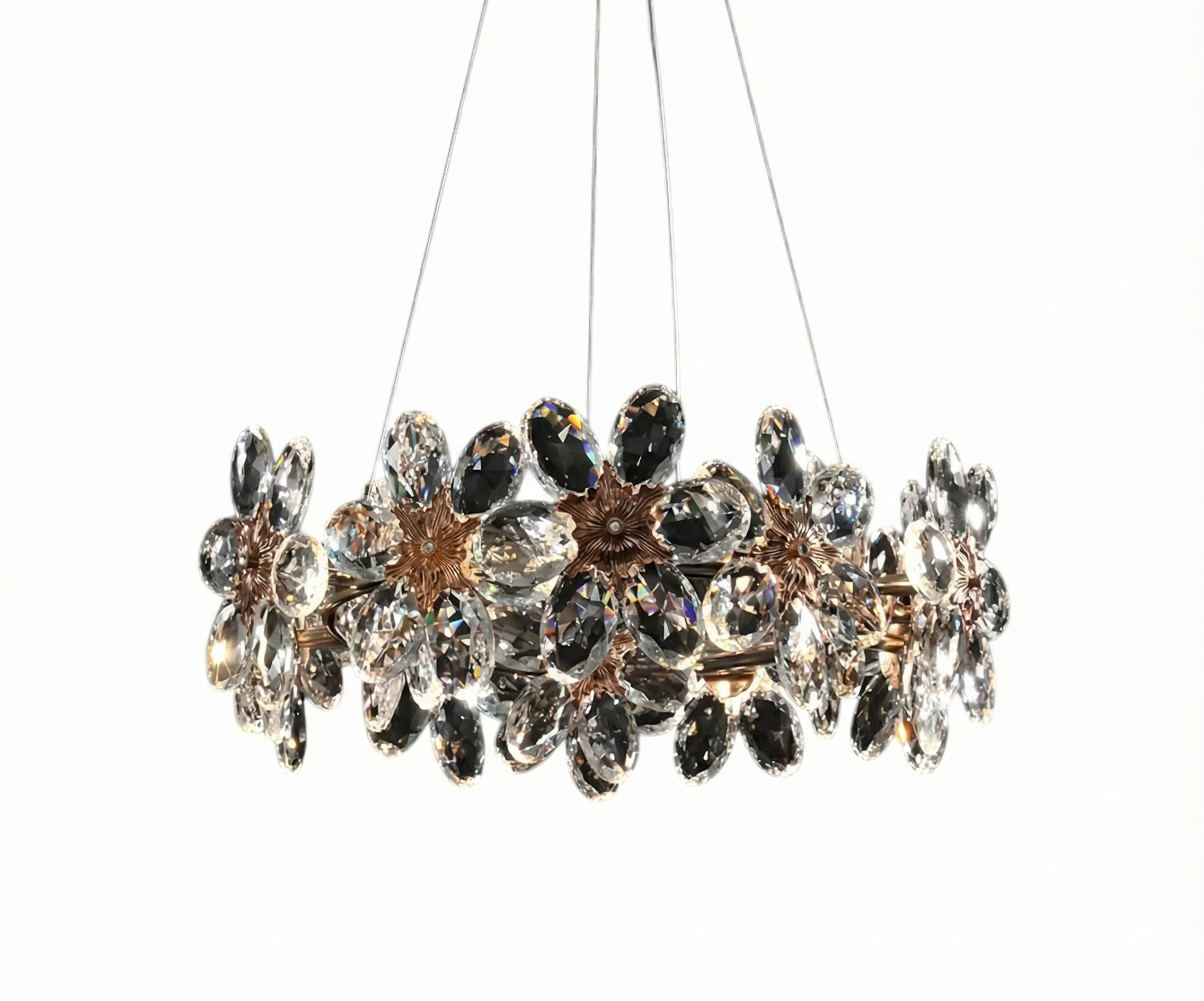 Lights in Qatar Crystal Burst chandelier above a long dining table