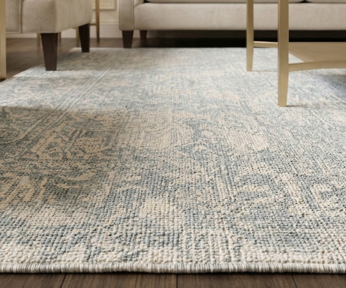 LUMIERE vintage blue distressed area rug, 150x230 cm, in a cream living room