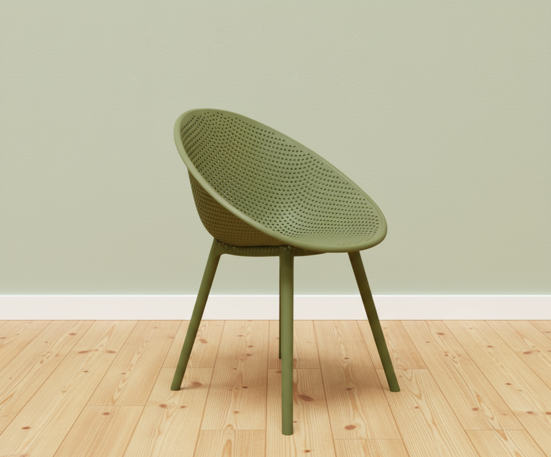 Lunar olive perforated designer armchair, angled view against a sage wall