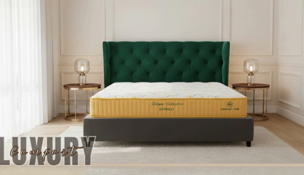 Luxury mattress in gold, on a dark bed base with a green tufted headboard