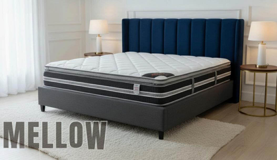 Mellow pillow-top mattress with a striped grey border, with a navy channel headboard