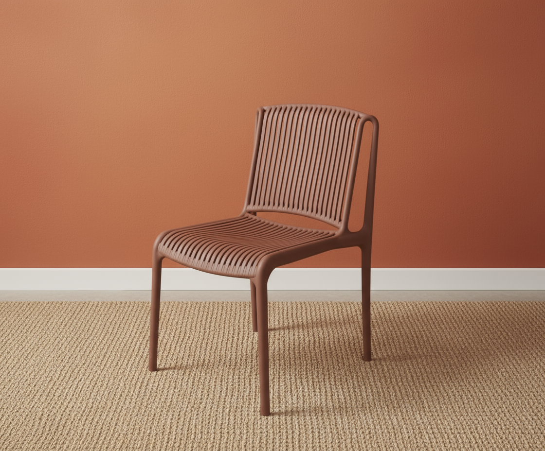 Minimalist designer side chair 1799 in rust, angled view on a woven rug