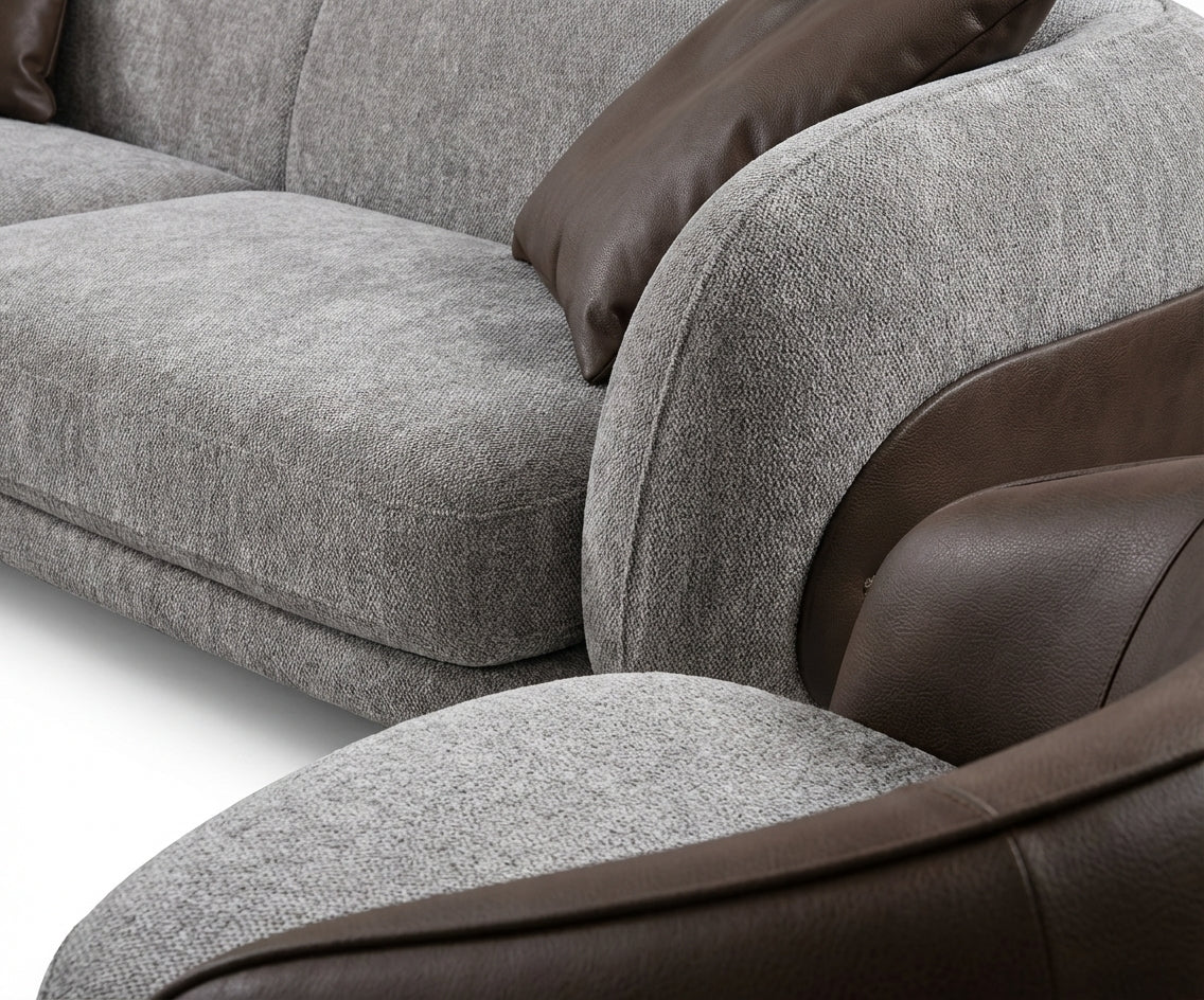 Moon grey curved sofa set in a city-view living room at dusk
