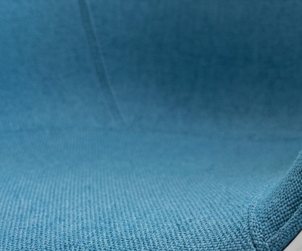MS910 office chair, close-up of its teal woven upholstery