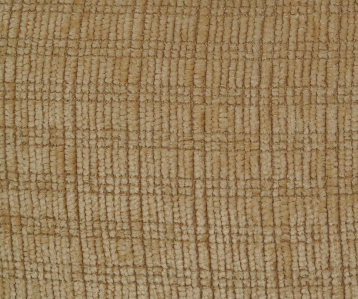 Natural woven linen cushion cover on a green sofa in a grey room