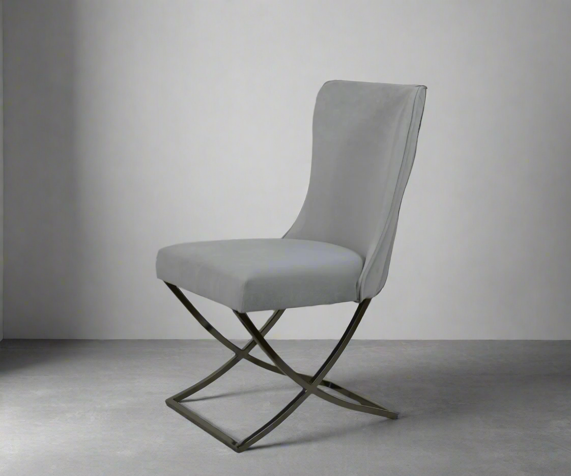 NEHIR two-tone designer dining chair, angled view in grey on an X-frame base