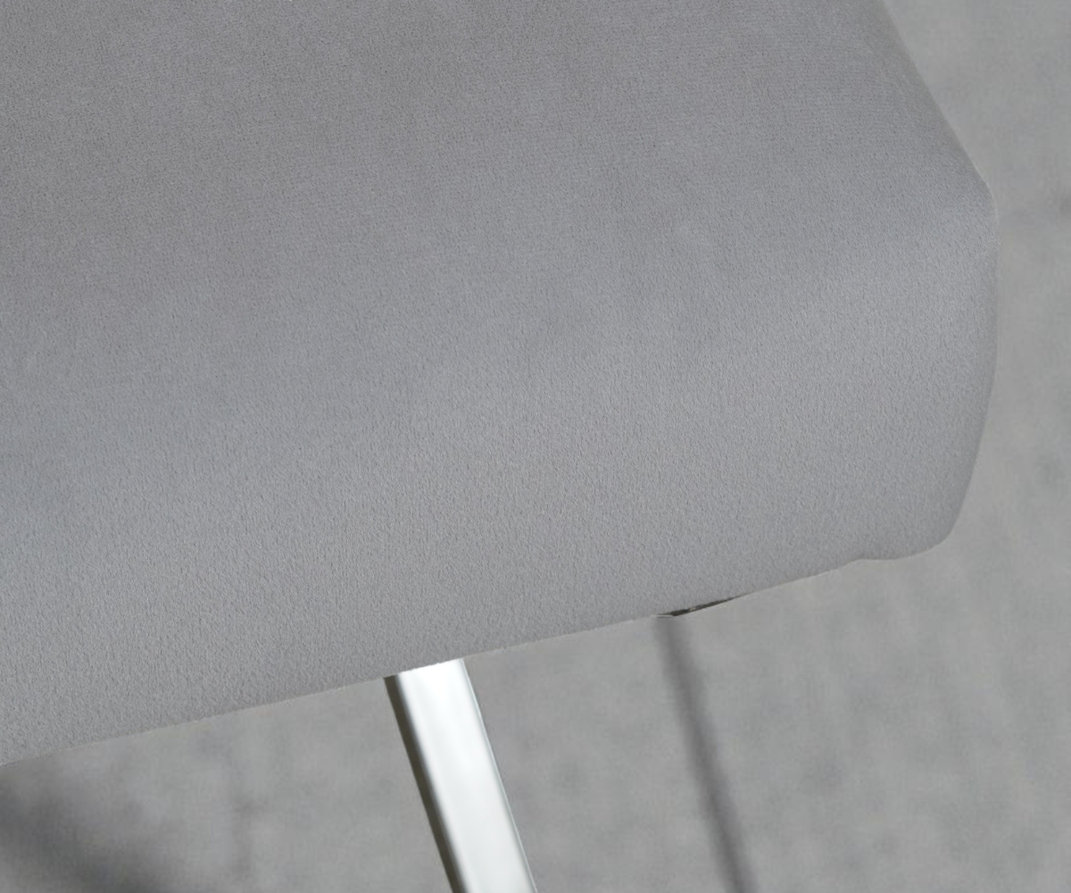 NEHIR two-tone designer dining chair, angled view in grey on an X-frame base