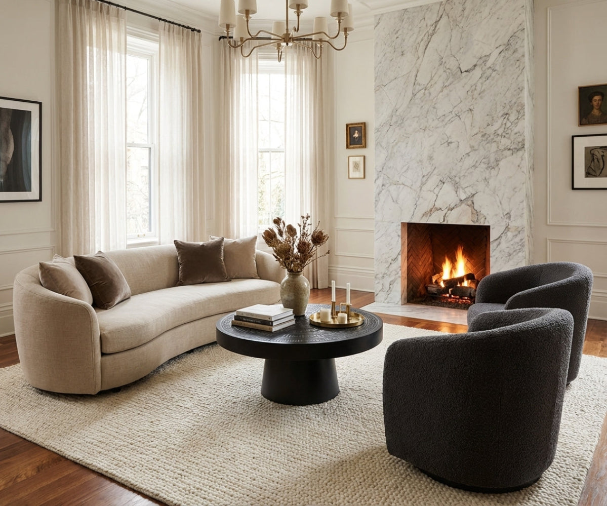NO:405 black pedestal table in a bright room with a marble fireplace