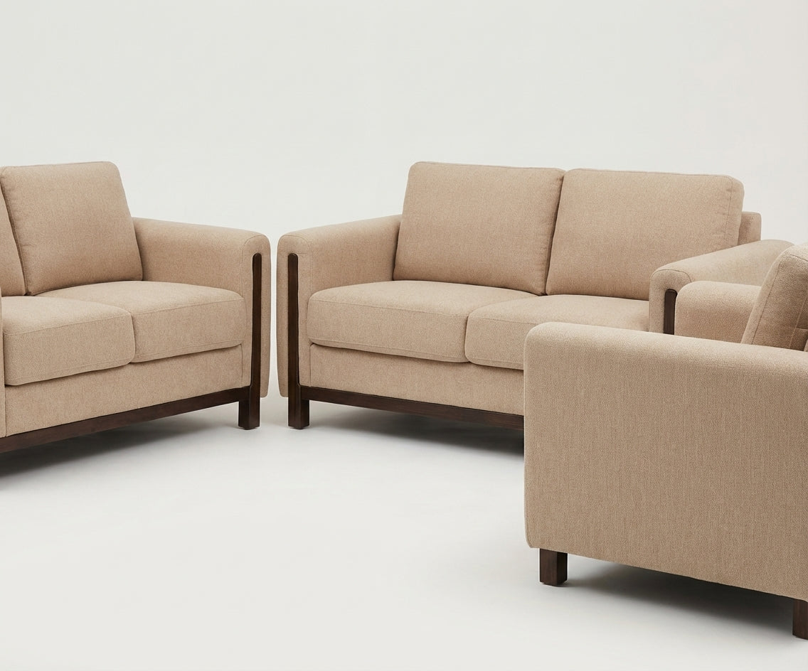 Nobu beige fabric sofa set in a bright living room with a fireplace