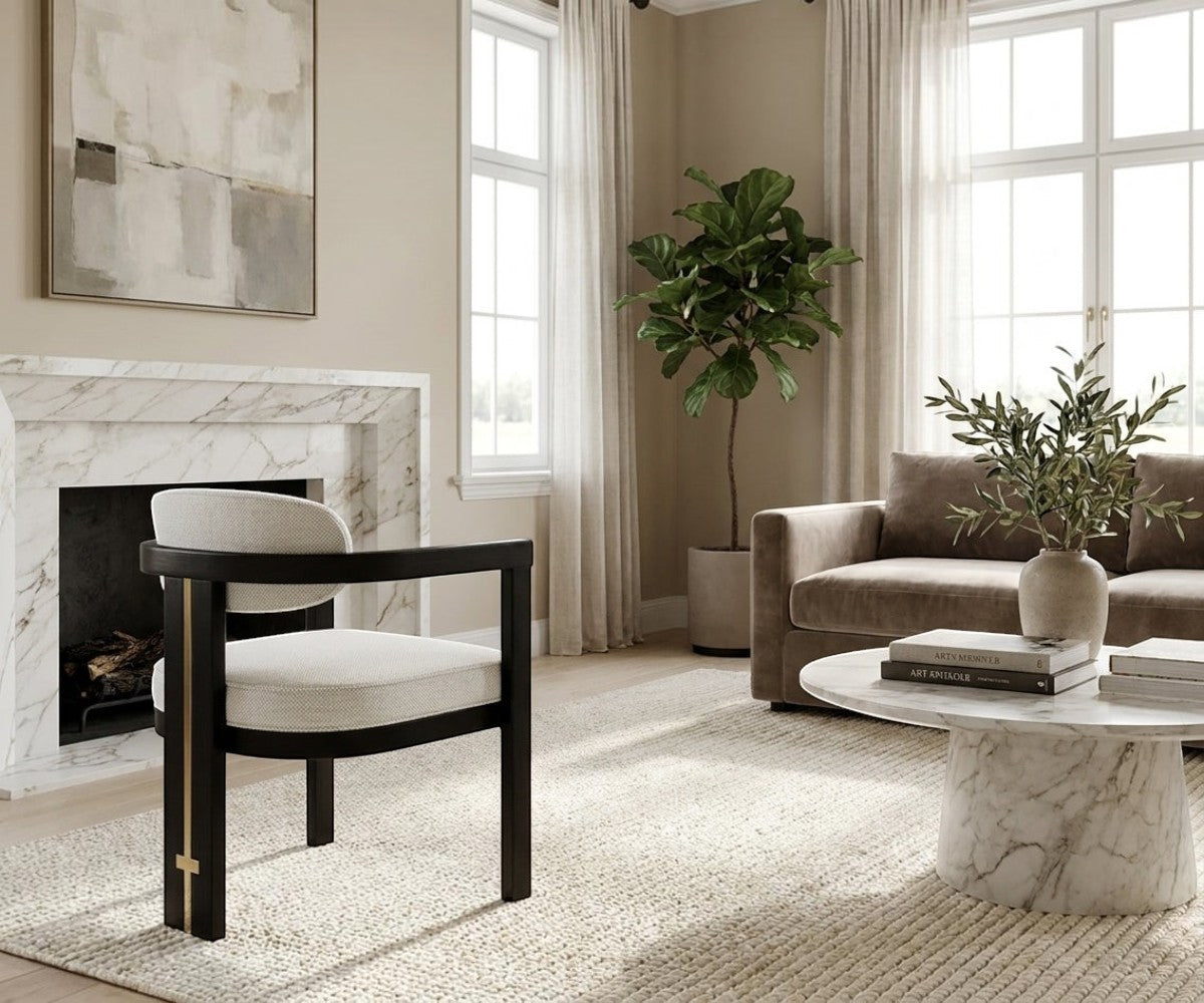 NOTTE elegant grey armchair beside a marble fireplace in a bright room