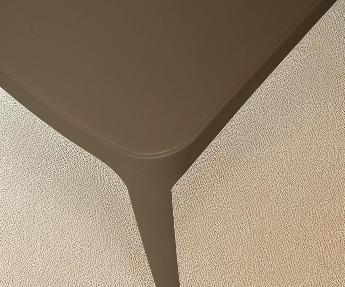 NVS-019-01 sculptural armless dining chair, front view in taupe