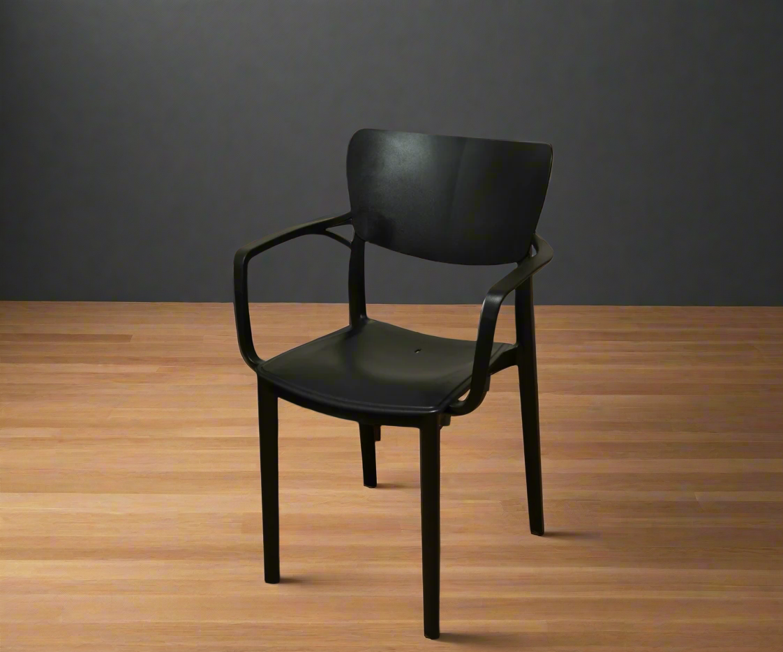 NVS-020-01 midnight modern designer armchair, angled view on a wood floor