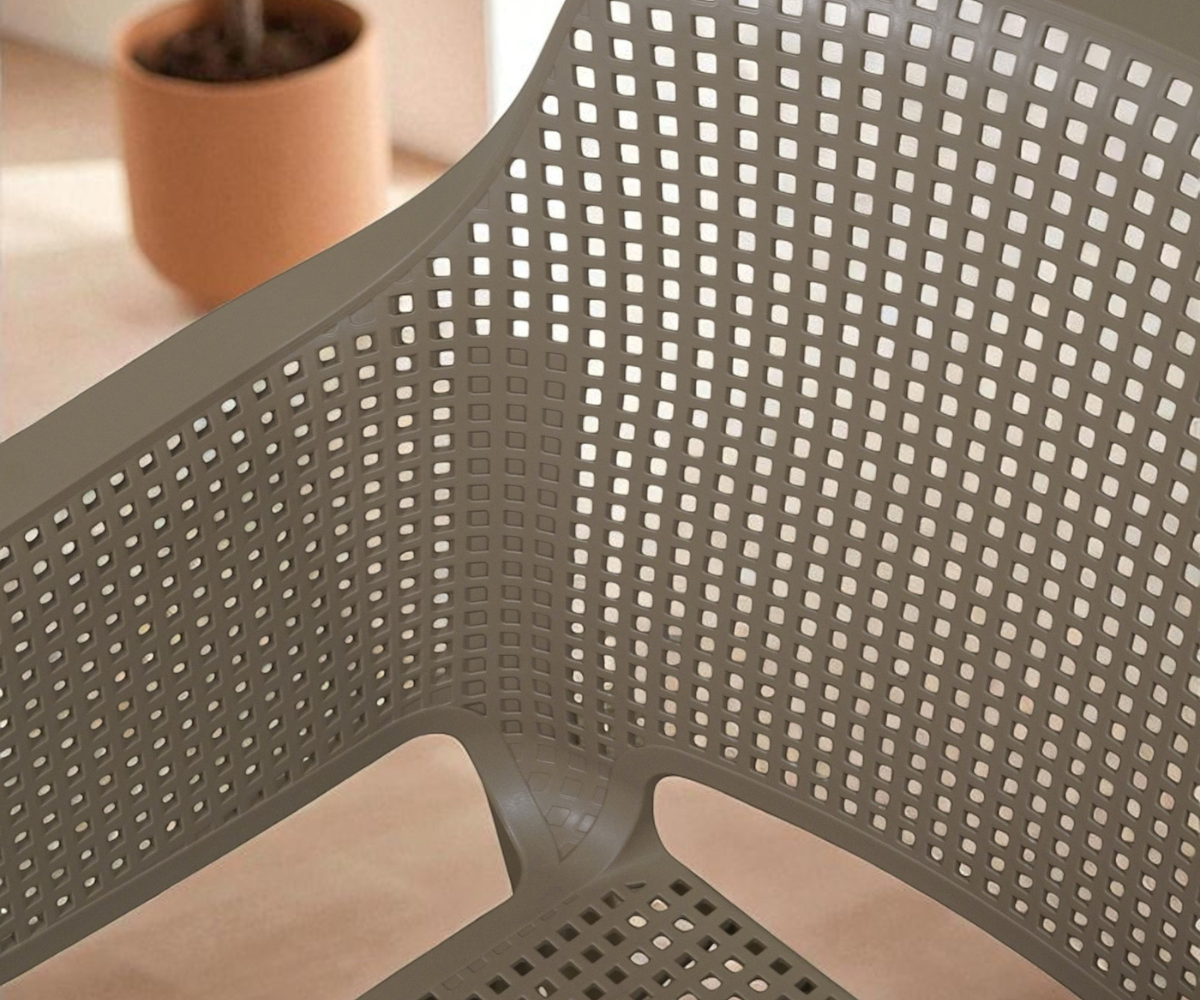 NVS-085-04 designer armchair in taupe, angled view with a mesh back