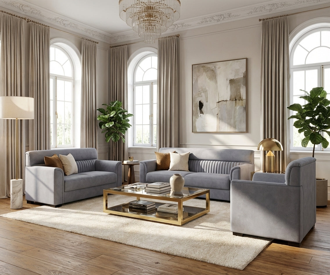 Opulent grey velvet sofa set in a bright room with arched windows