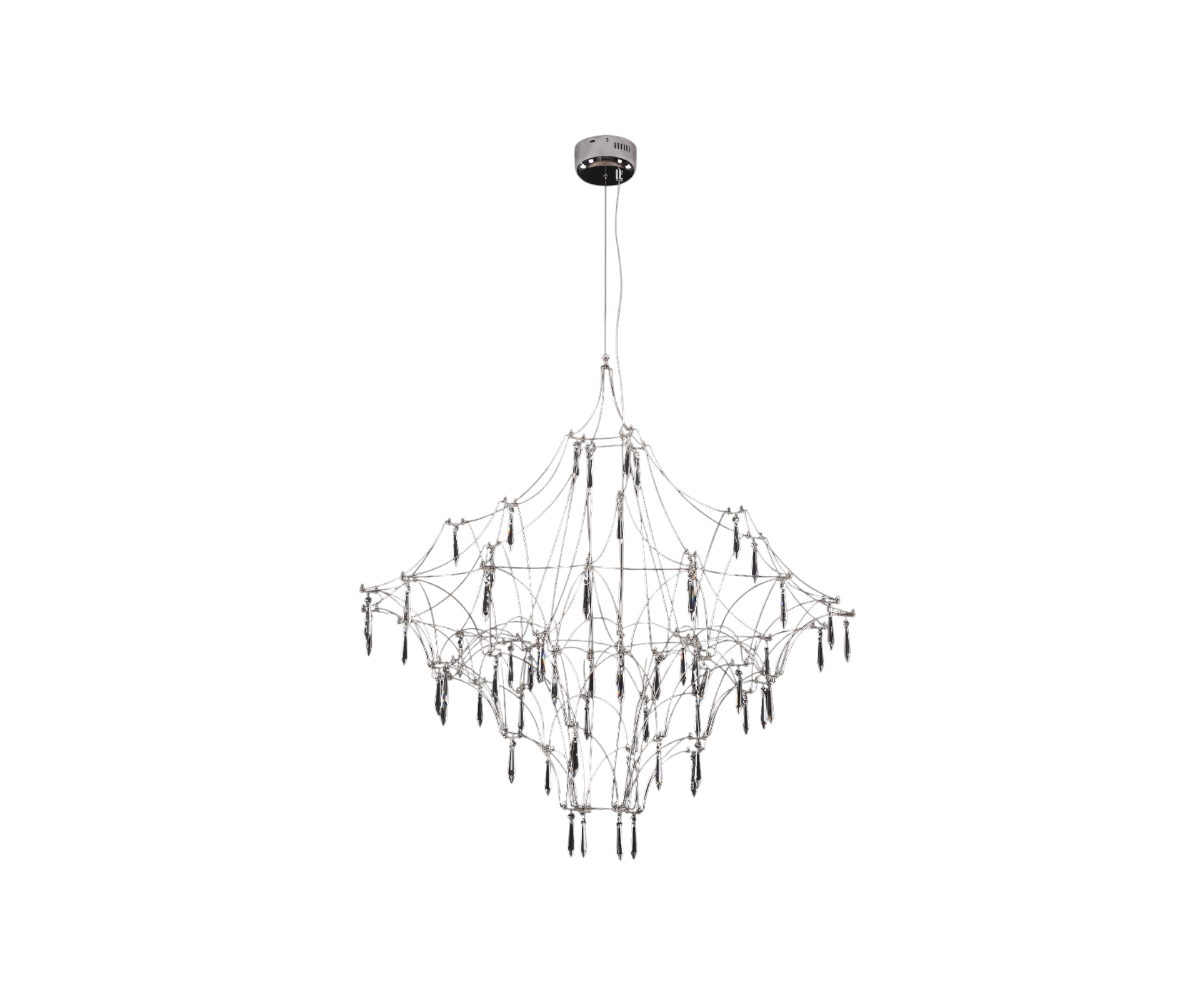 Qatar LED branch pendant light above a walnut dining table by tall windows