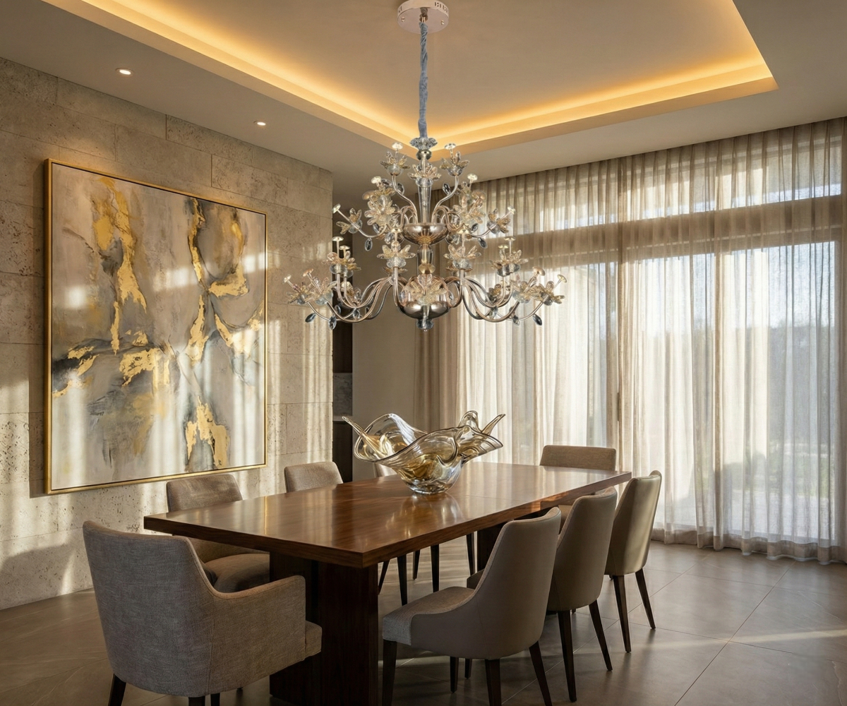 Qatar Lighting crystal chandelier above a dining table beside gold artwork