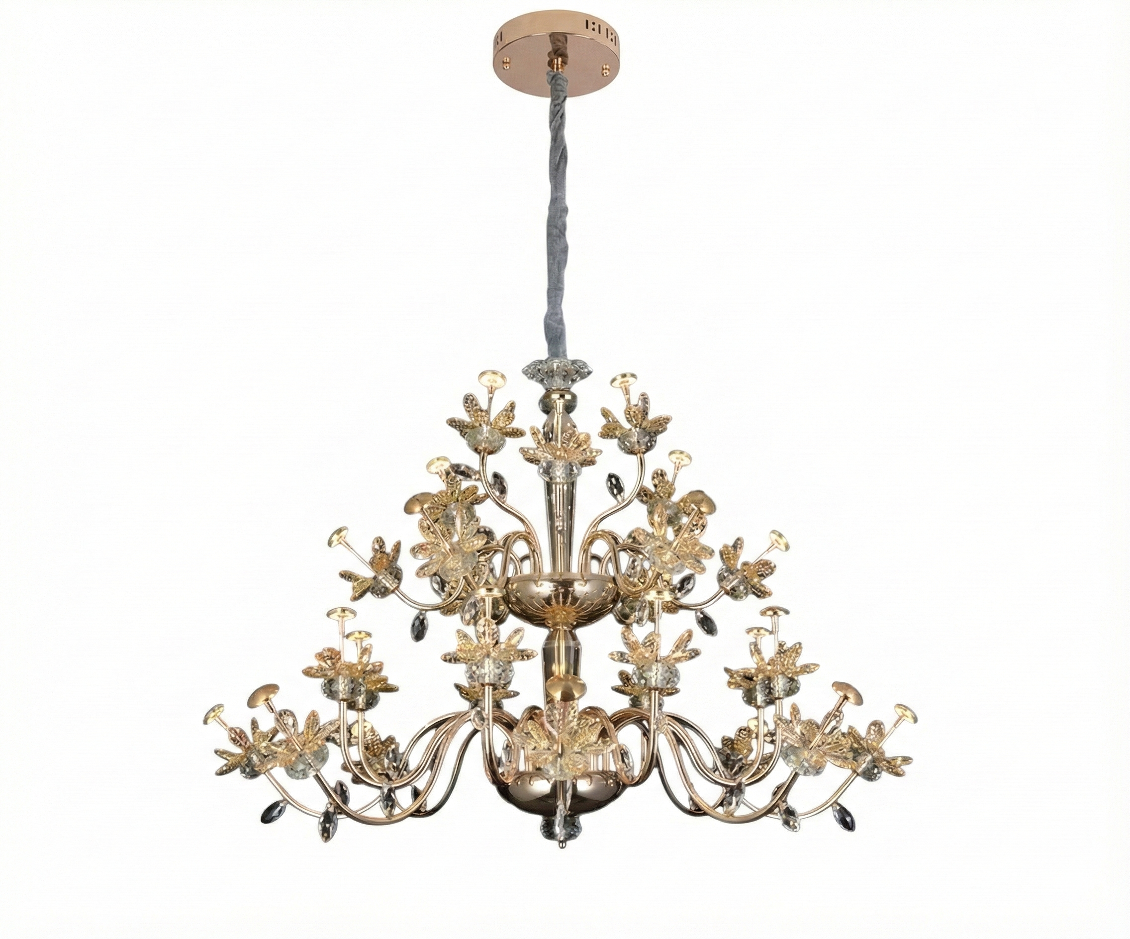 Qatar Lighting crystal chandelier above a dining table beside gold artwork