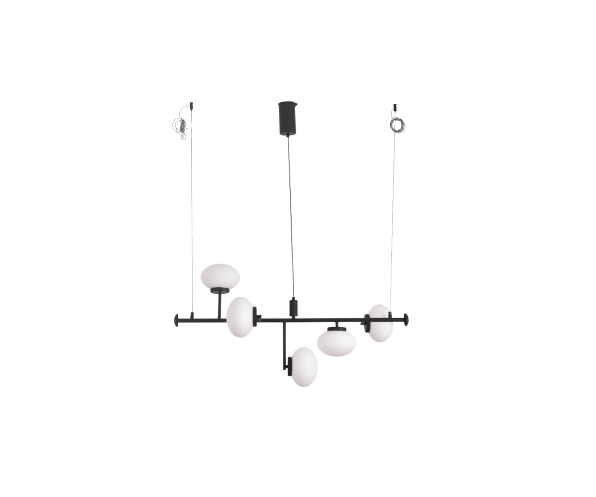 Qatar Lighting globe fixture above a dark dining table in a city-view room