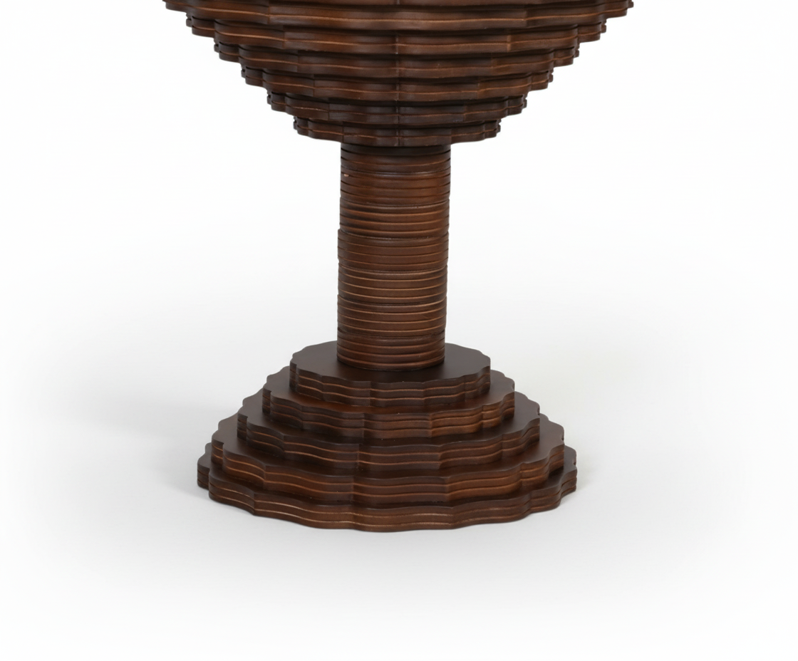 Selena round walnut table, front view with a scalloped stepped pedestal