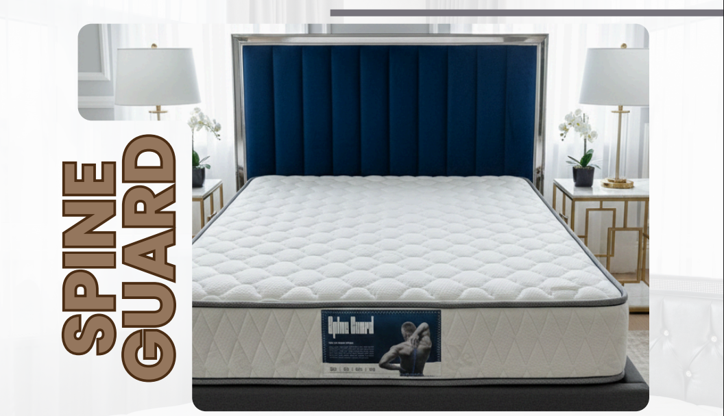 Spine Guard pillow-top mattress with a grey border, with a navy channel headboard
