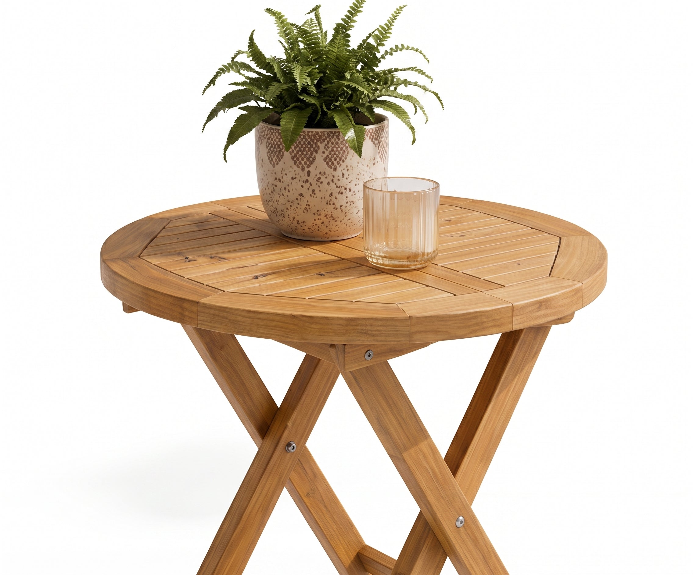 TAB ROUND.50 outdoor teak table with two folding chairs on a sunlit terrace