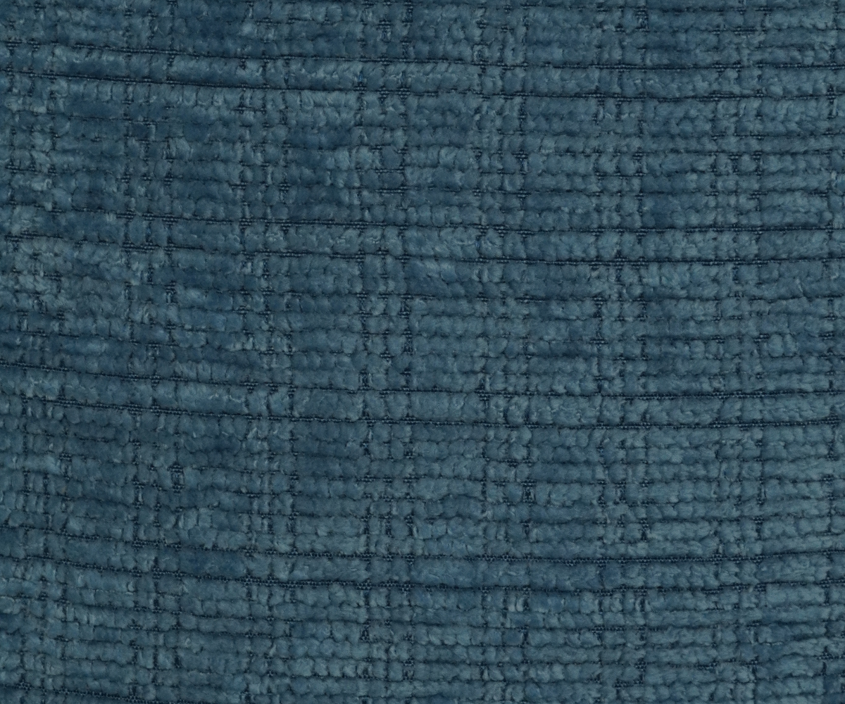 Teal textured linen cushion cover on a grey sofa in a dark panelled room