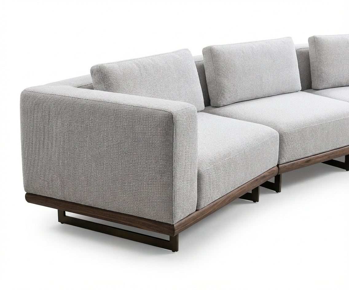 Tetra grey modular sofa in a city-view living room at sunset
