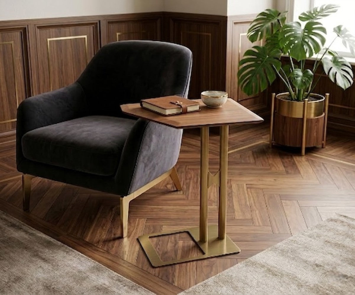 TETRA square wooden table beside a dark armchair in a panelled room