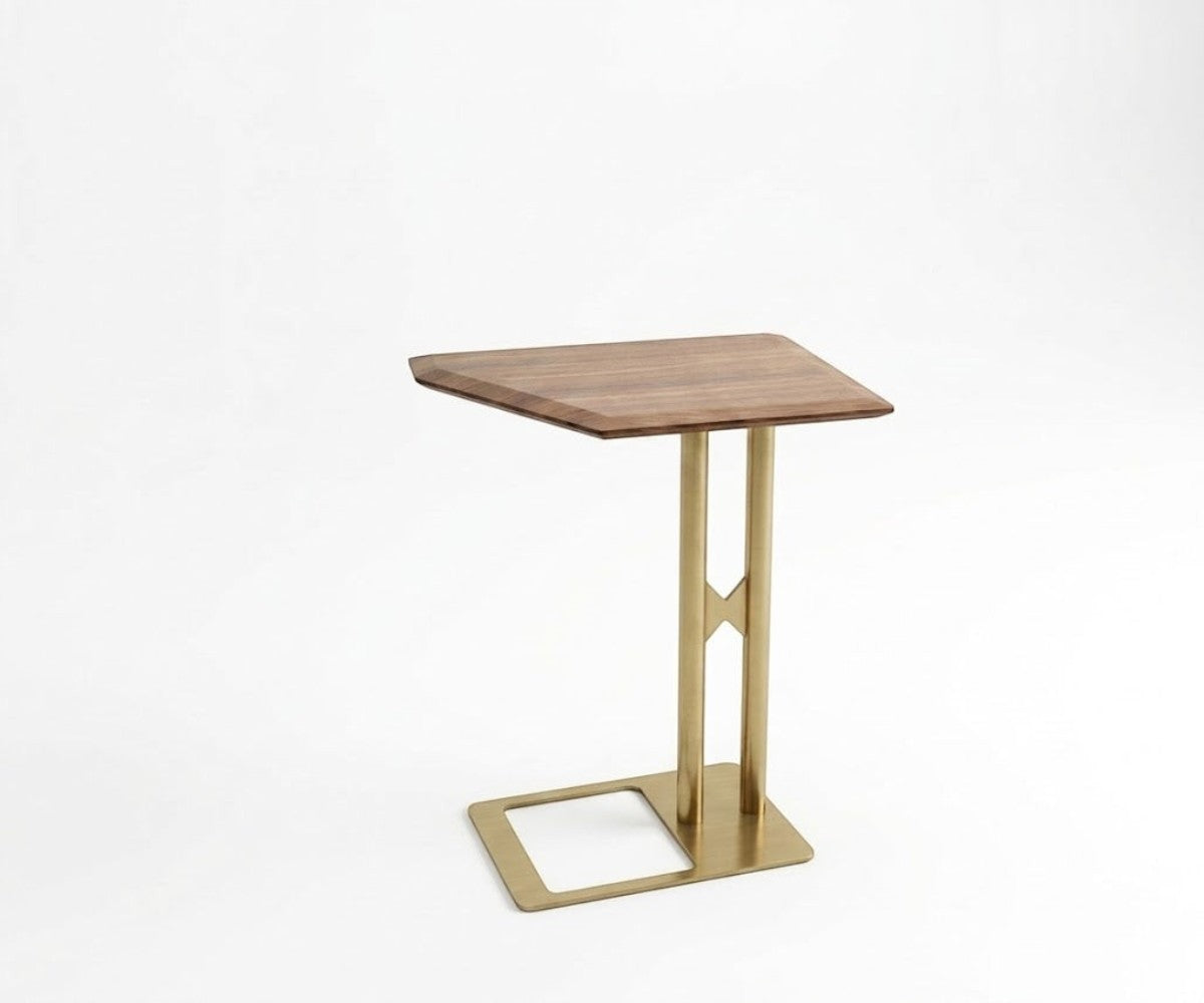 TETRA square wooden table beside a dark armchair in a panelled room