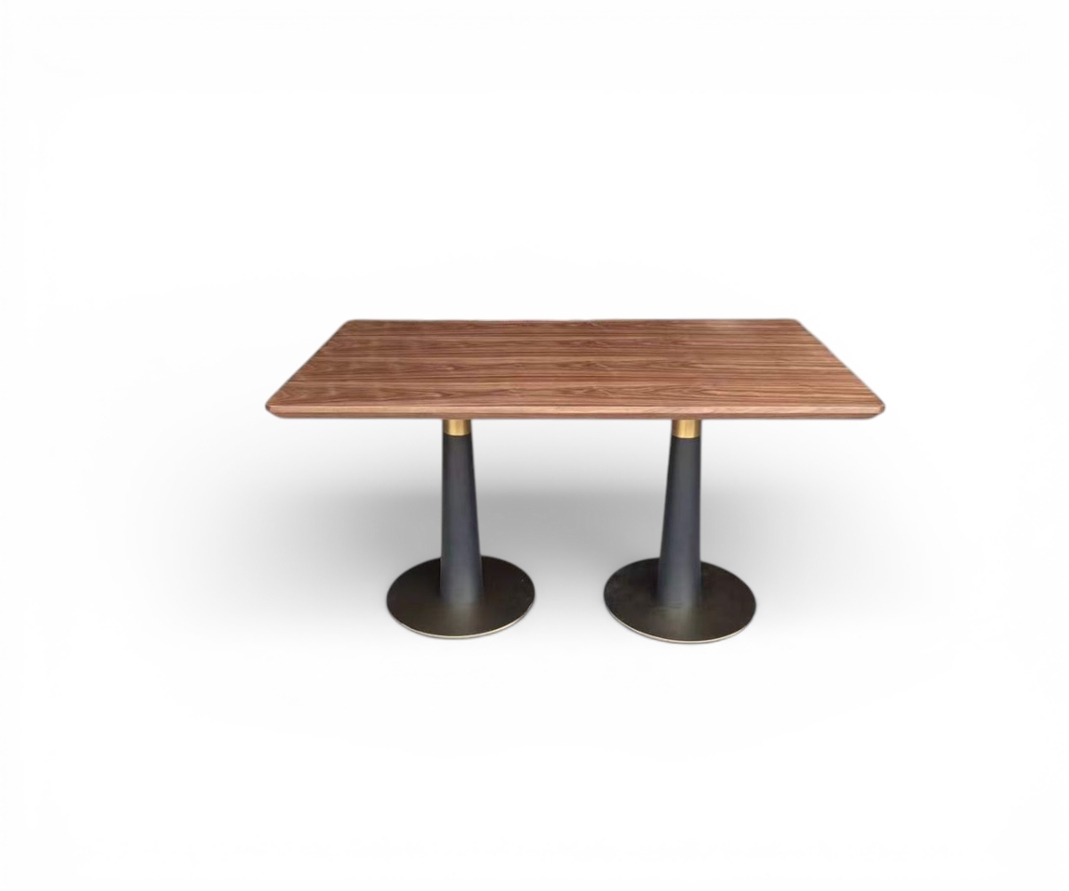 Tribeca dual pedestal table in a city-view lounge on dark marble flooring