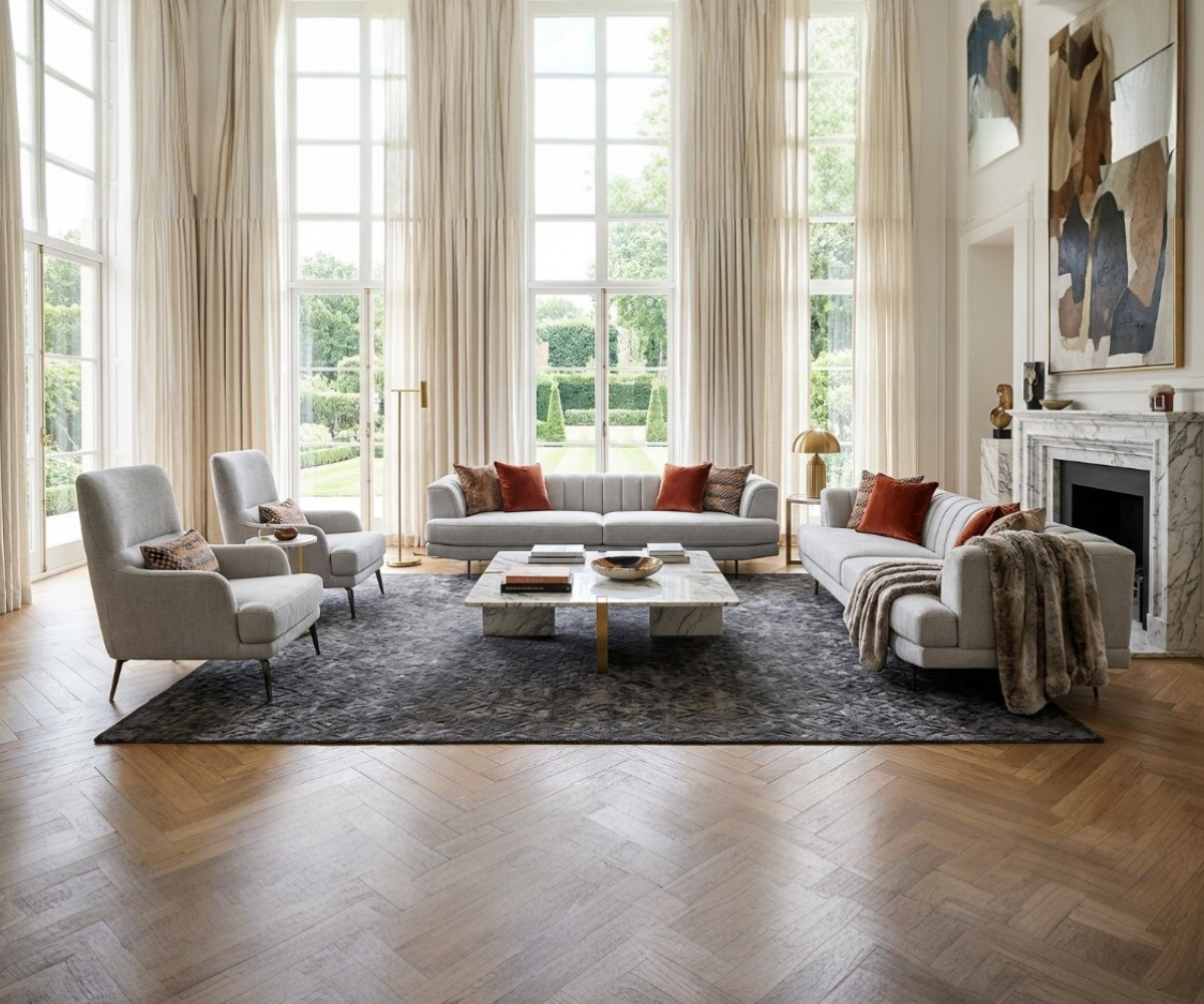 VERSACE grey fabric sofa set in a bright room with tall windows